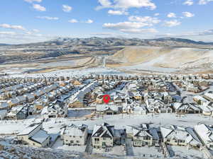 Snowy aerial view with a mountain view