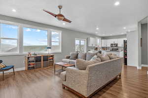 Living room with a textured ceiling and light wood-type flooring