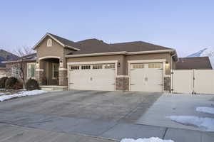 Prairie-style house featuring a garage and a mountain view