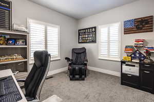 Home office with carpet flooring