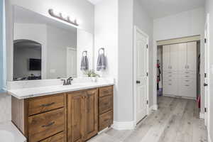 Bathroom featuring vanity and hardwood / wood-style floors