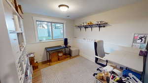 Office area featuring light hardwood / wood-style flooring