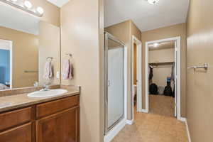 Primary bathroom with separate soaking tub and shower. Walk-in closet.