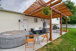 View of patio / terrace with area for grilling, outdoor lounge area, and a pergola