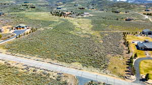 Drone / aerial view featuring a mountain view and a rural view