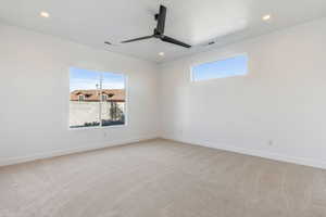 Unfurnished room with carpet and ceiling fan