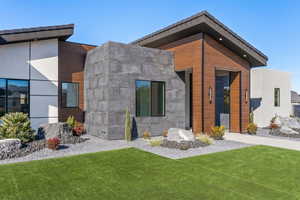 Modern home with a front lawn