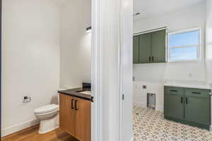 Bathroom featuring vanity and toilet