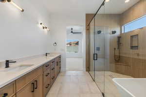 Bathroom featuring vanity, tile patterned floors, independent shower and bath, and ceiling fan