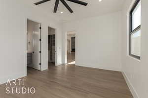 Spare room featuring hardwood / wood-style floors and ceiling fan