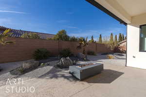 View of patio featuring a fire pit