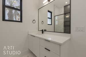 Bathroom with vanity and walk in shower