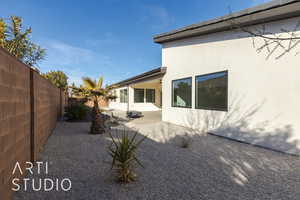 Back of house with a patio