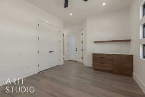 Entrance foyer with hardwood / wood-style flooring and ceiling fan