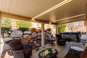 View of patio / terrace featuring a hot tub