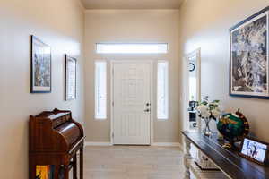 Foyer entrance featuring a healthy amount of sunlight and light wood-type flooring