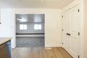 Corridor featuring light hardwood / wood-style flooring