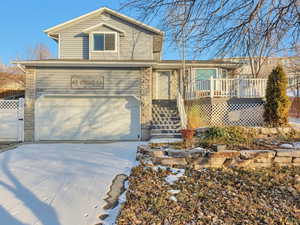 View of front facade featuring a garage