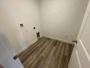 Clothes washing area featuring hookup for a washing machine, dark wood-type flooring, and hookup for an electric dryer