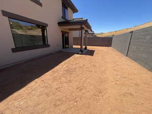 View of yard with a mountain view and a patio