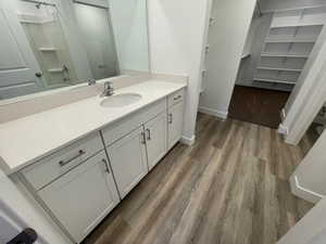 Bathroom with vanity and hardwood / wood-style floors