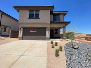 View of front of property featuring a garage