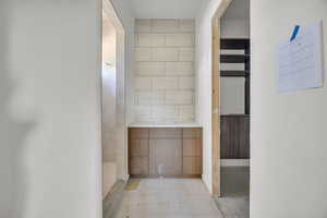 Bathroom featuring tile walls