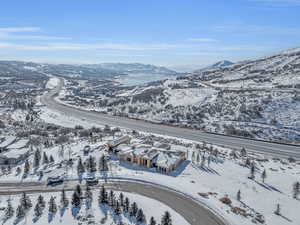 Snowy aerial view featuring a mountain view