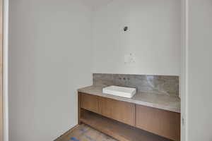 Bathroom featuring wood finished floors and vanity
