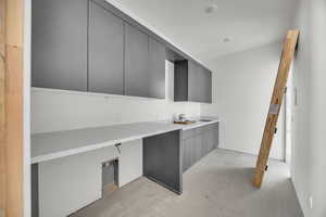 Kitchen featuring gray cabinetry and modern cabinets