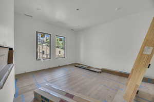 Unfurnished room featuring hardwood / wood-style flooring