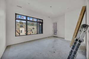 Unfurnished room featuring concrete floors