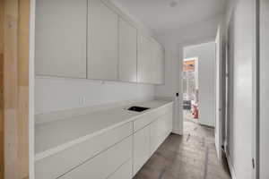 Washroom featuring light wood finished floors