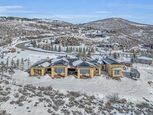 Snowy aerial view featuring a mountain view