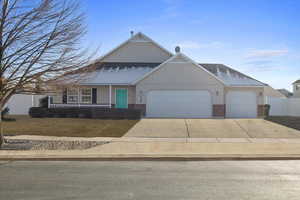 View of front of property featuring a garage