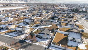 Snowy aerial view featuring a mountain view