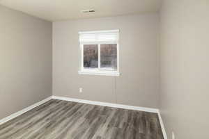 Unfurnished room featuring hardwood / wood-style floors