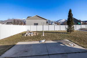 View of yard featuring a mountain view and a patio