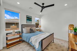 Bedroom with ceiling fan and light wood-type flooring