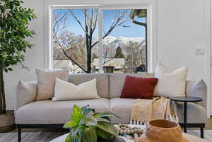 Living area with a mountain view and hardwood / wood-style flooring