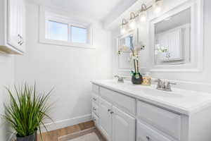 Bathroom featuring vanity and hardwood / wood-style floors