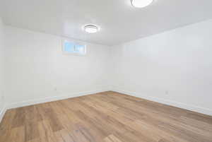 Empty room featuring light hardwood / wood-style flooring