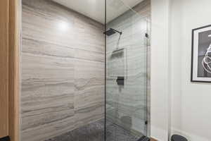 Bathroom featuring a shower with shower door