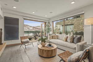 Sunroom featuring a mountain view