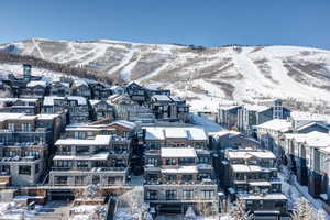 Snowy aerial view featuring a mountain view