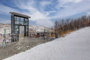 Snowy yard featuring a mountain view