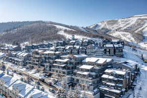 Snowy aerial view with a mountain view