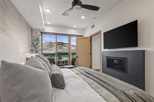 Bedroom featuring access to outside and ceiling fan