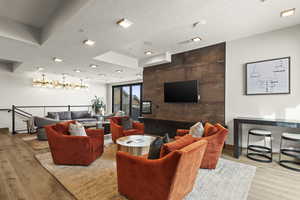 Living room featuring light hardwood / wood-style floors and a textured ceiling