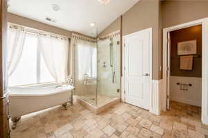 Bathroom with independent shower and bath and vaulted ceiling